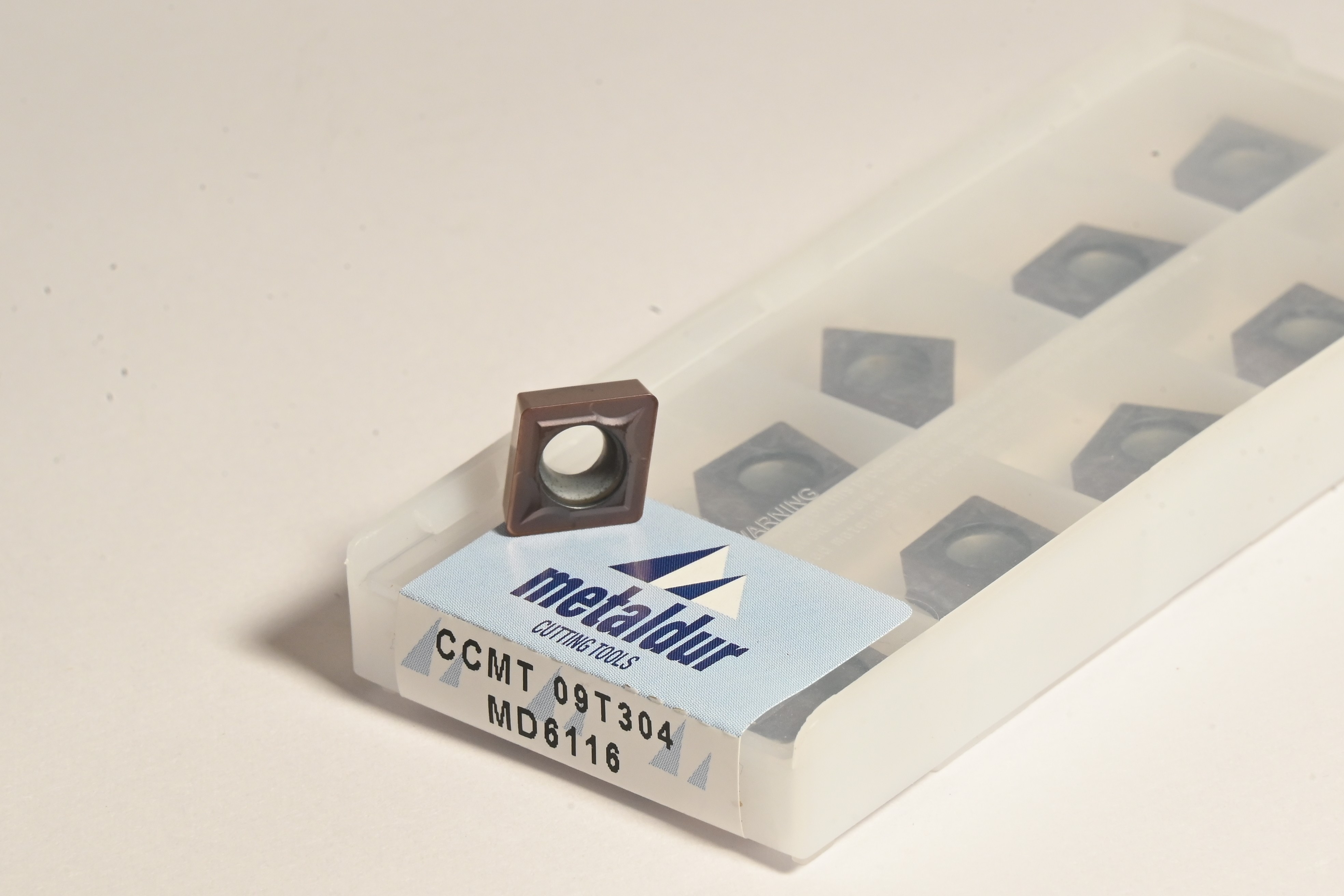 Positive turning inserts for CNC finishing and semi-finishing operations